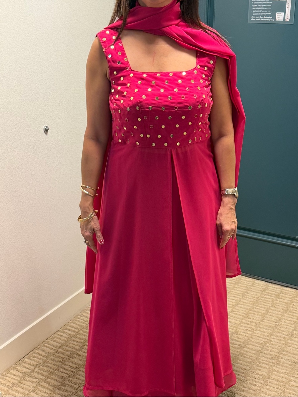 Elegant Fuchsia Sleeveless Lehenga Dress with Gold Accents